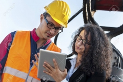 young female engineer talks about working with a worker